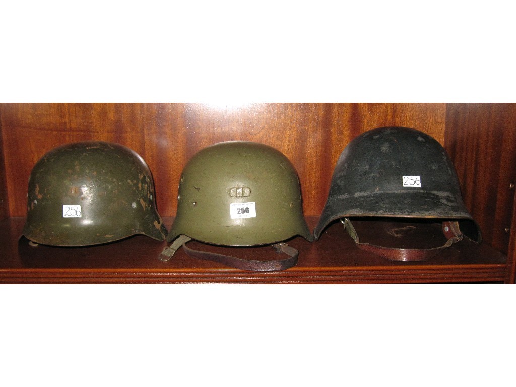 Appraisal: Lot comprising two German helmets and one other