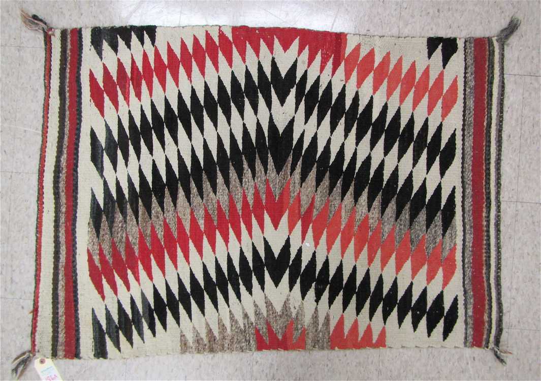 Appraisal: VINTAGE NAVAJO WEAVING having repeating parallelograms in an arch design