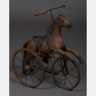 Appraisal: A Contemporary Carved Hardwood and Metal Child's Horse Form Tricycle