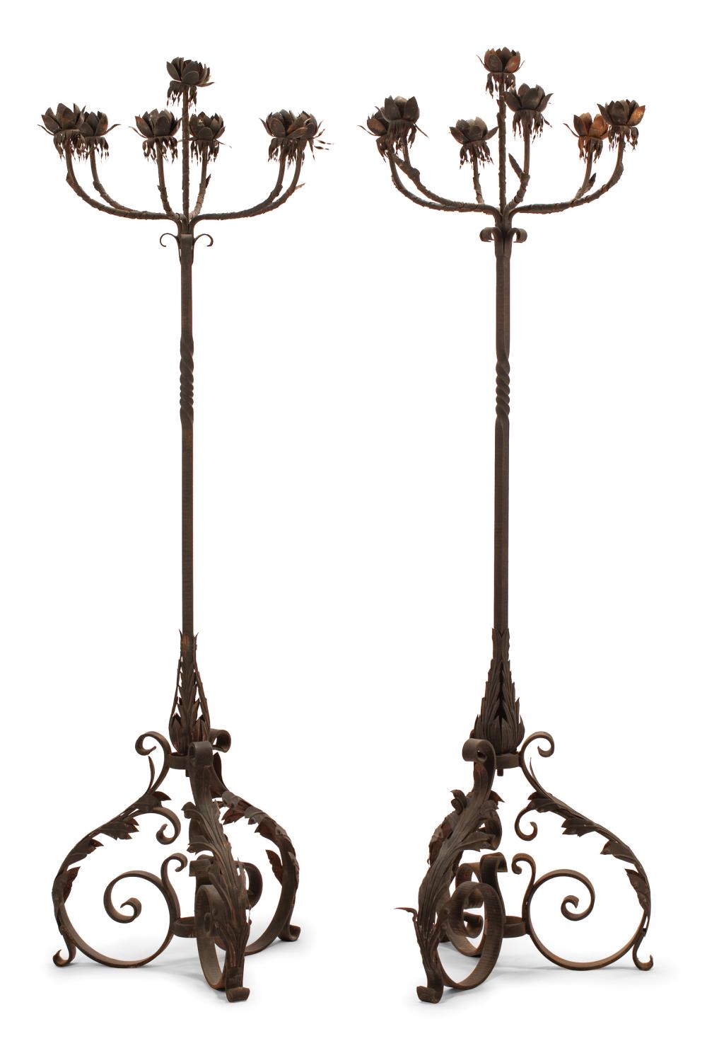 Appraisal: Pair of Wrought Iron and Tole Seven-Light Torcheres foliate candle