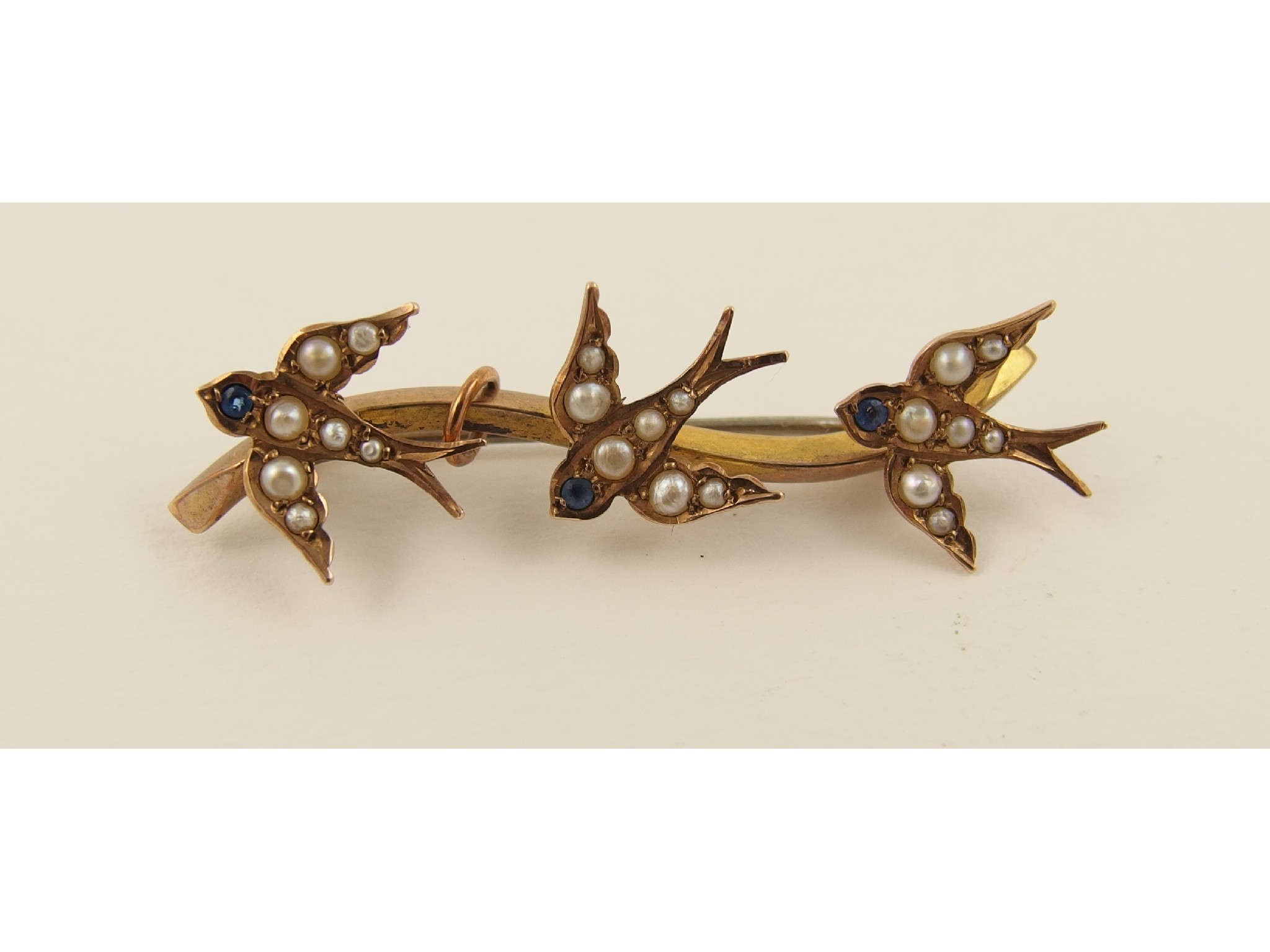 Appraisal: A ct Edwardian swallow brooch set with split pearls and