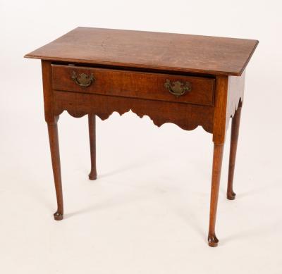 Appraisal: An th Century oak lowboy circa with ogee apron and