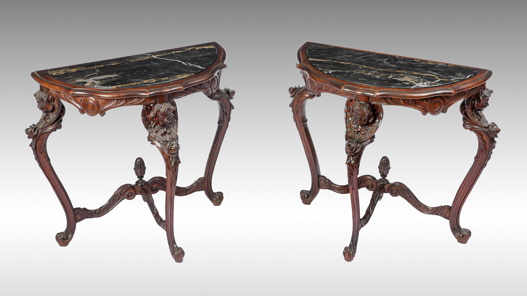 Appraisal: PAIR OF CARVED MARBLE TOP FIGURAL DEMILUNE TABLES - Demilune