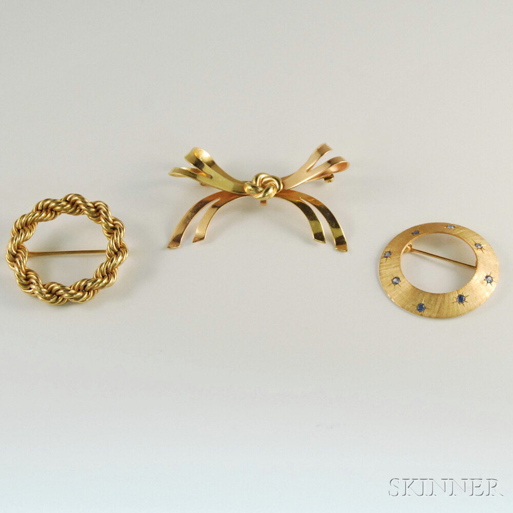 Appraisal: Three Gold Brooches a kt gold ropetwist circle pin a