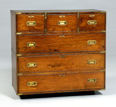 Appraisal: British mahogany campaign chest in two sections with brass mounts