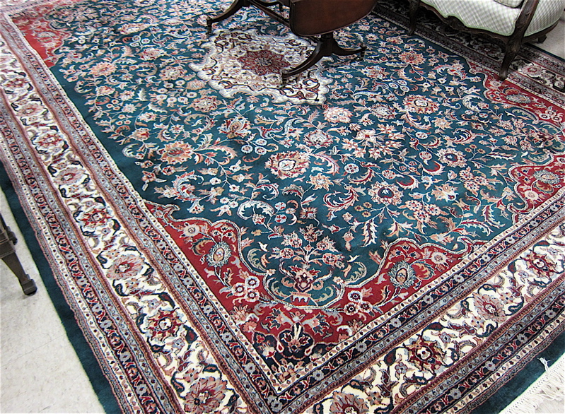 Appraisal: HAND KNOTTED ORIENTAL CARPET Indo-Persian floral and central floral medallion