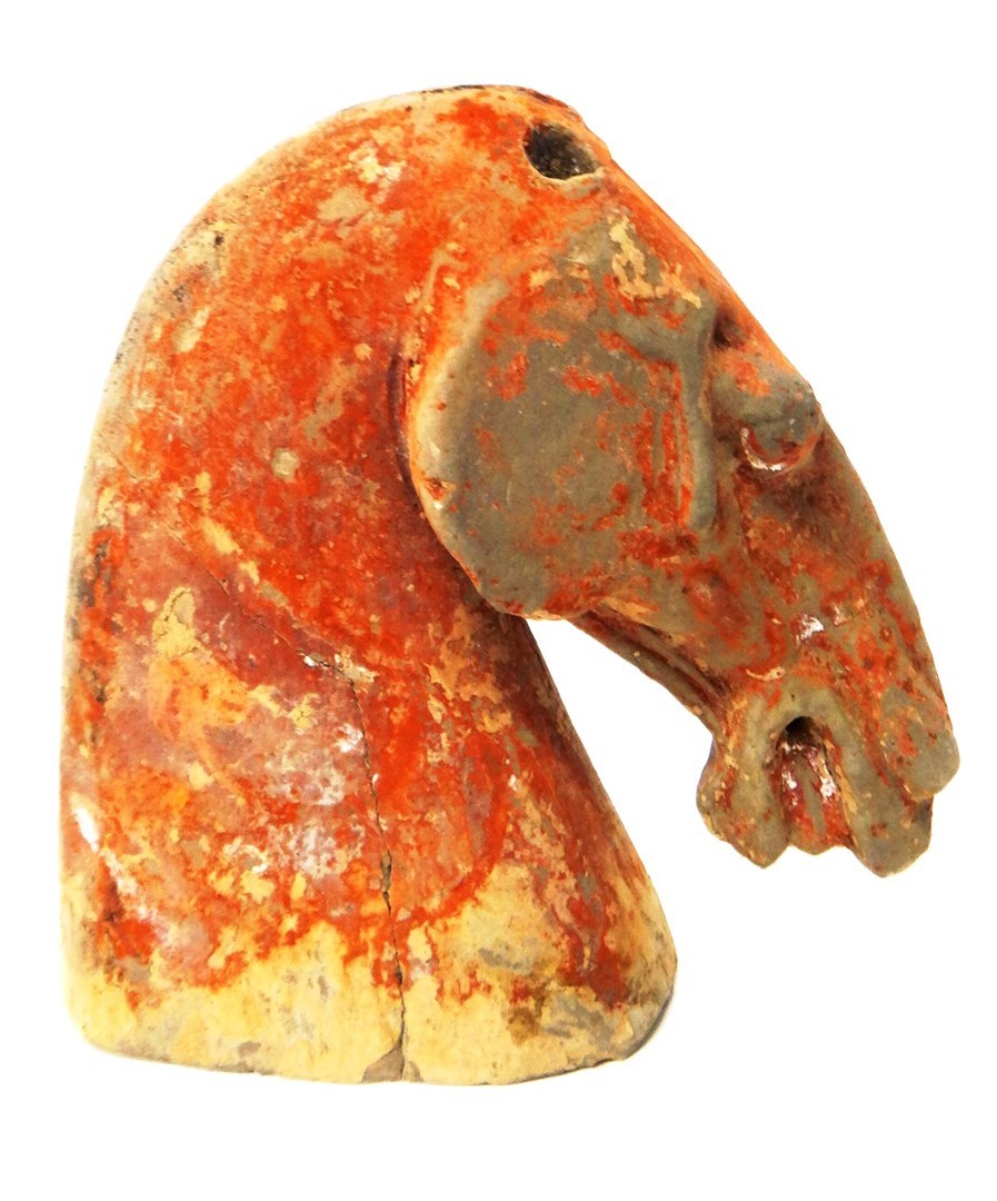 Appraisal: A Chinese painted grey pottery horse head Han Dyansty covered