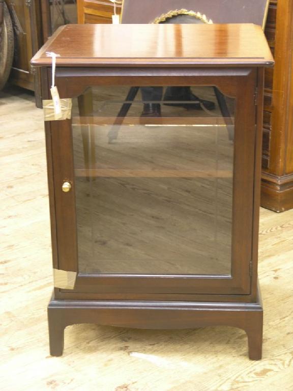 Appraisal: A Stag mahogany cabinet enclosed by single glazed door ft