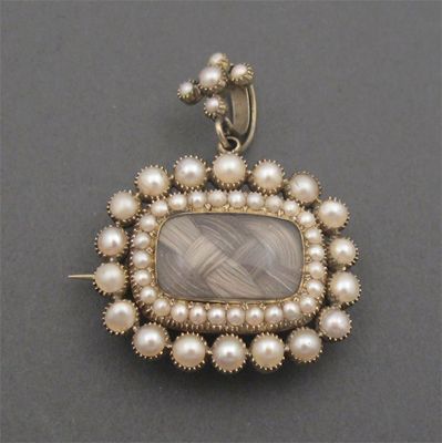 Appraisal: A George III pearl locket brooch centred with a glazed