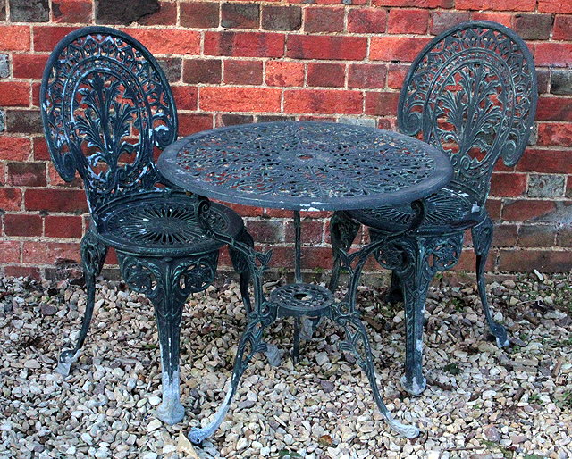 Appraisal: A GREEN PAINTED CAST ALUMINIUM CIRCULAR GARDEN TRIPOD TABLE with