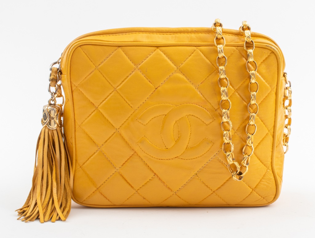 Appraisal: VINTAGE CHANEL QUILTED YELLOW LEATHER CAMERA BAG Vintage Chanel quilted