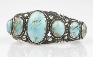 Appraisal: A Native American silver cuff bracelet Navajo set with turquoise