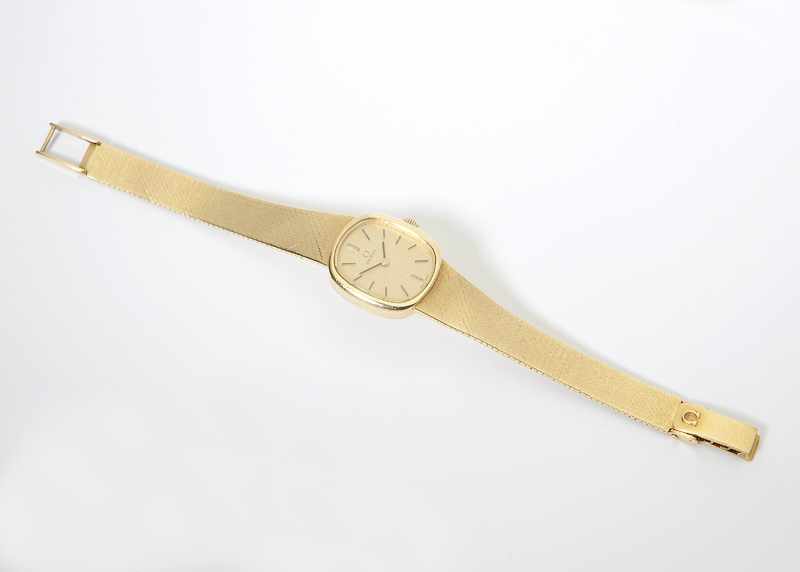 Appraisal: A lady's K gold wristwatch Omega The elliptical gold tone