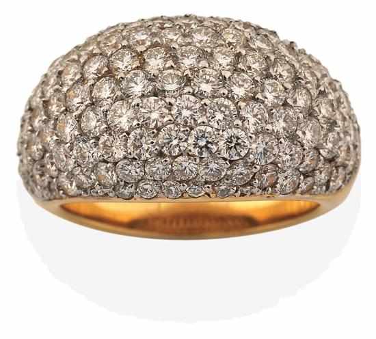 Appraisal: A DIAMOND DRESS RING Of bombe design pave set with