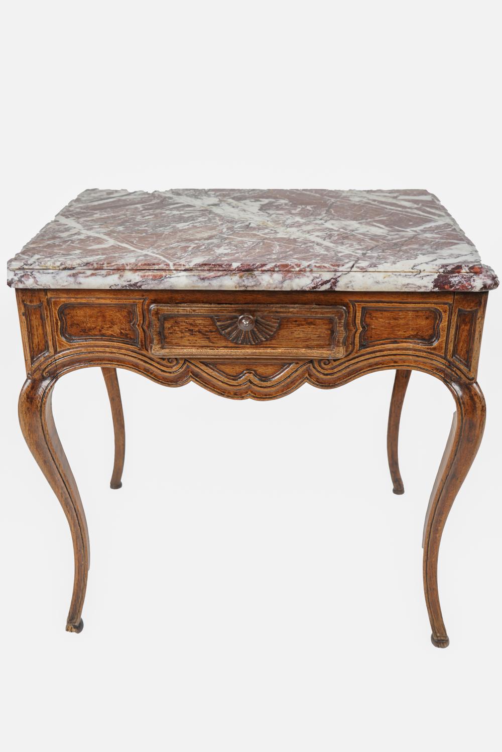 Appraisal: FRENCH PROVINCIAL MARBLE-TOP WALNUT LAMP TABLEwith single drawer Condition no