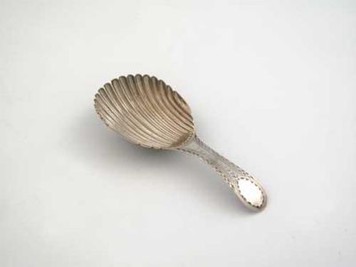 Appraisal: A rare George III caddy spoon with a fluted oval