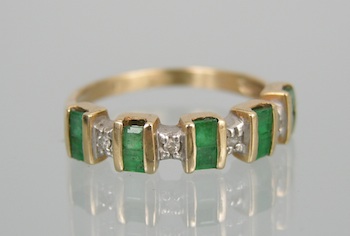 Appraisal: An Emerald and Diamond Band k yellow gold ring set