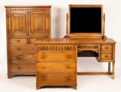 Appraisal: An oak millinery cupboard enclosed by a pair of linenfold