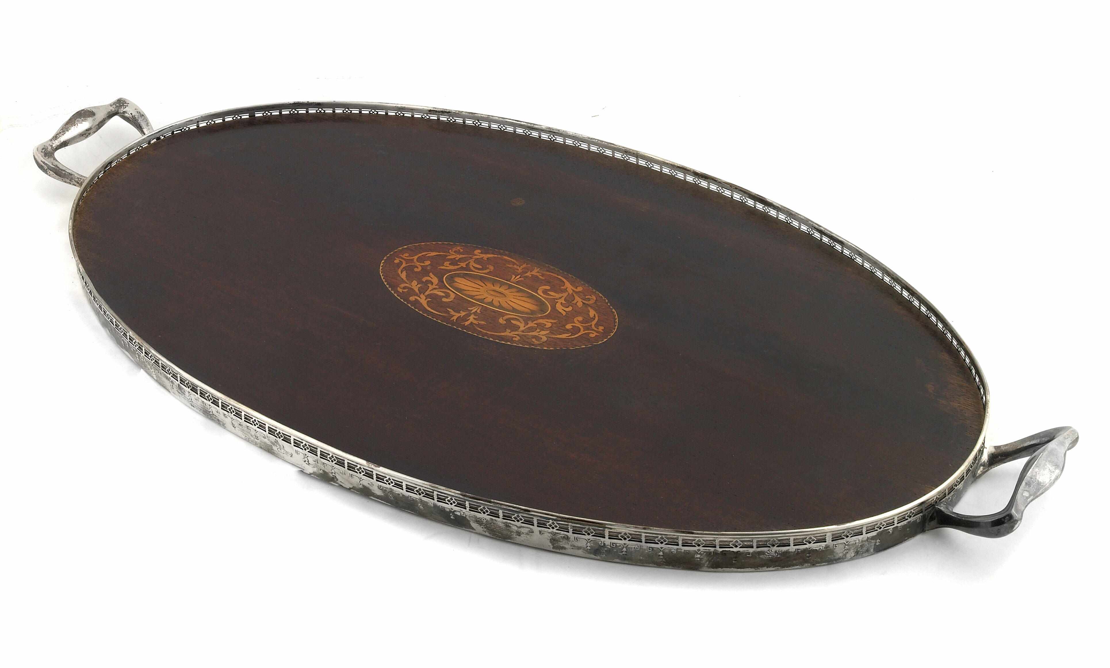 Appraisal: An inlaid mahogany base oval tea tray with sterling rim