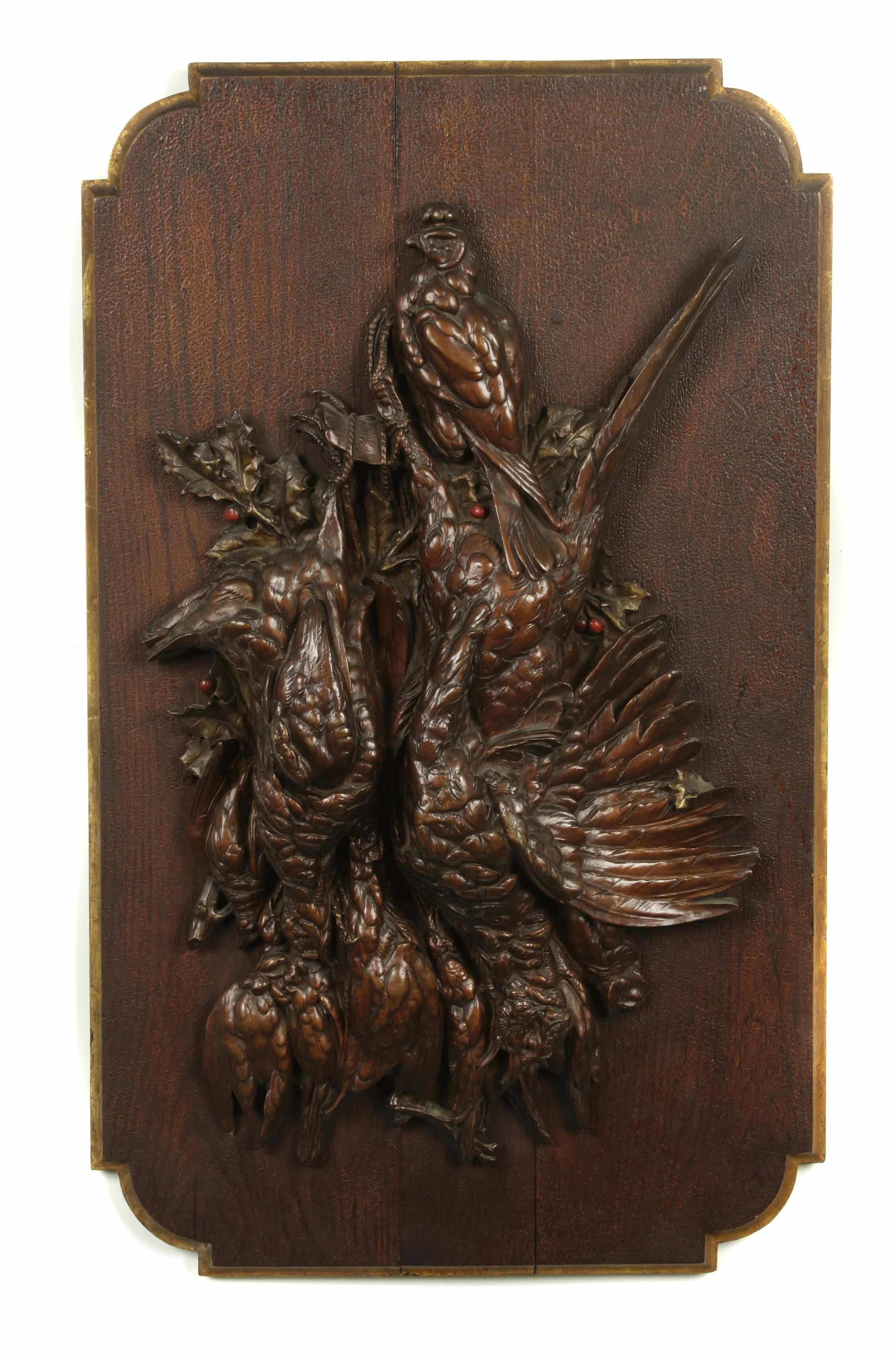 Appraisal: A Continental patinated bronze relief decorated plaque depicting game birds