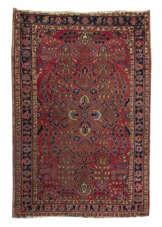 Appraisal: A Sarouk Wool Rug having a stylized foliate center medallion