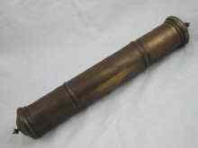 Appraisal: An Indian brass scroll holder containing an address to Mr