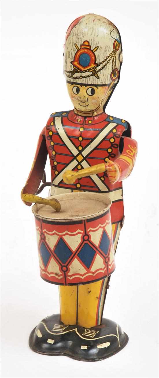 Appraisal: LOUIS MARX TINPLATE DRUMMER BOY white red yellow blue and