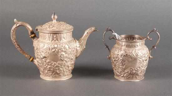 Appraisal: American repousse silver individual teapot and matching sugar bowl S