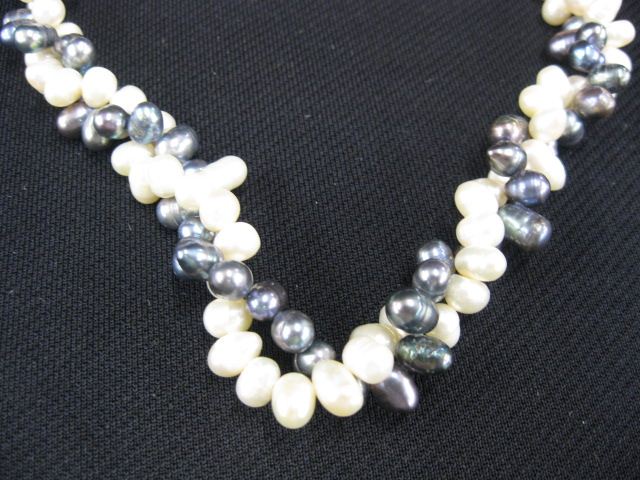 Appraisal: Pearl Necklace alternating black white acorn shape pearls long