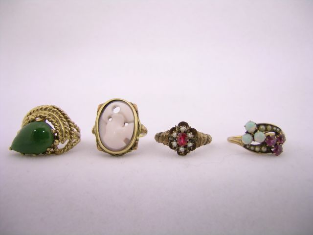 Appraisal: Four vintage rings including K gold ring with rope motif