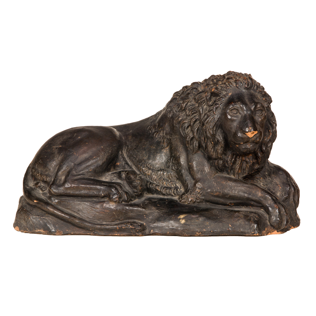 Appraisal: AN ITALIAN TINTED TERRACOTTA MODEL OF A RECUMBENT LION An