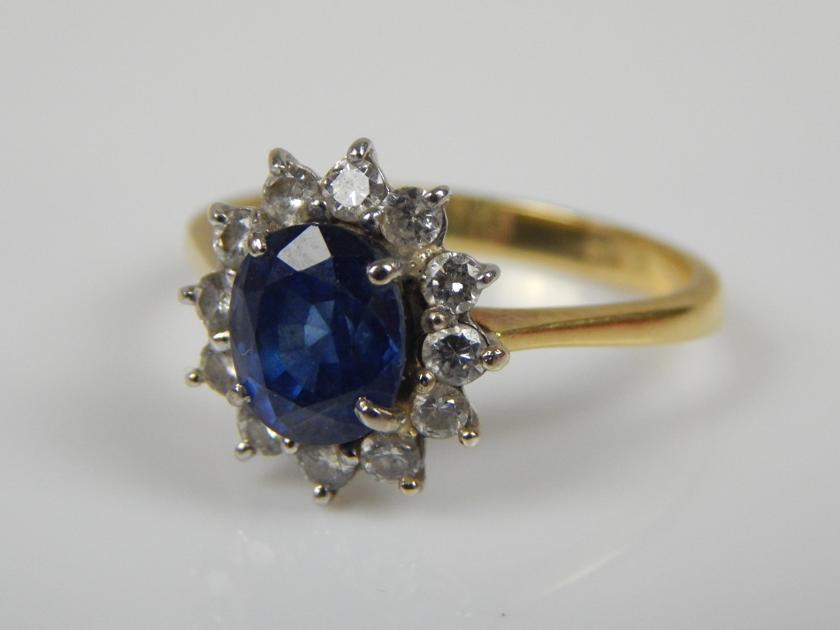 Appraisal: A sapphire and diamond floral cluster with central pale blue