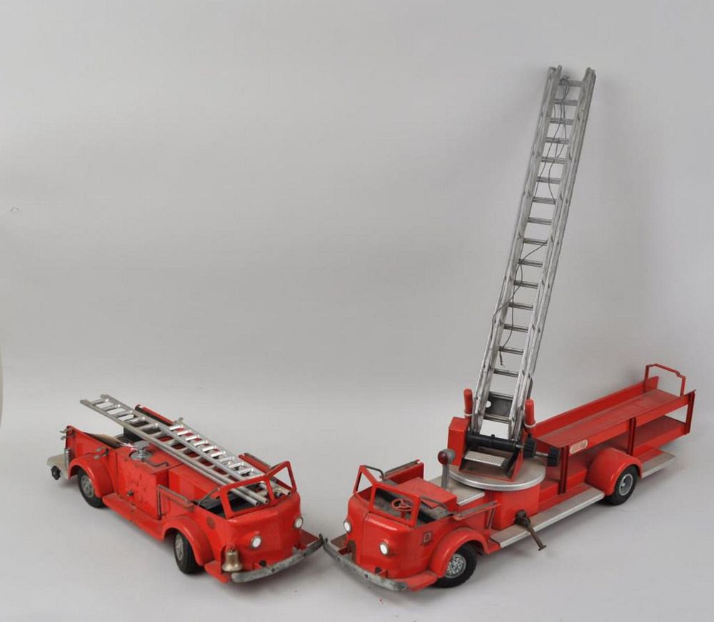 Appraisal: Two Red Painted Toy Fire Trucks with The Charles Doepke