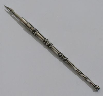 Appraisal: A white metal dip pen attributed to Omar Ramsden with