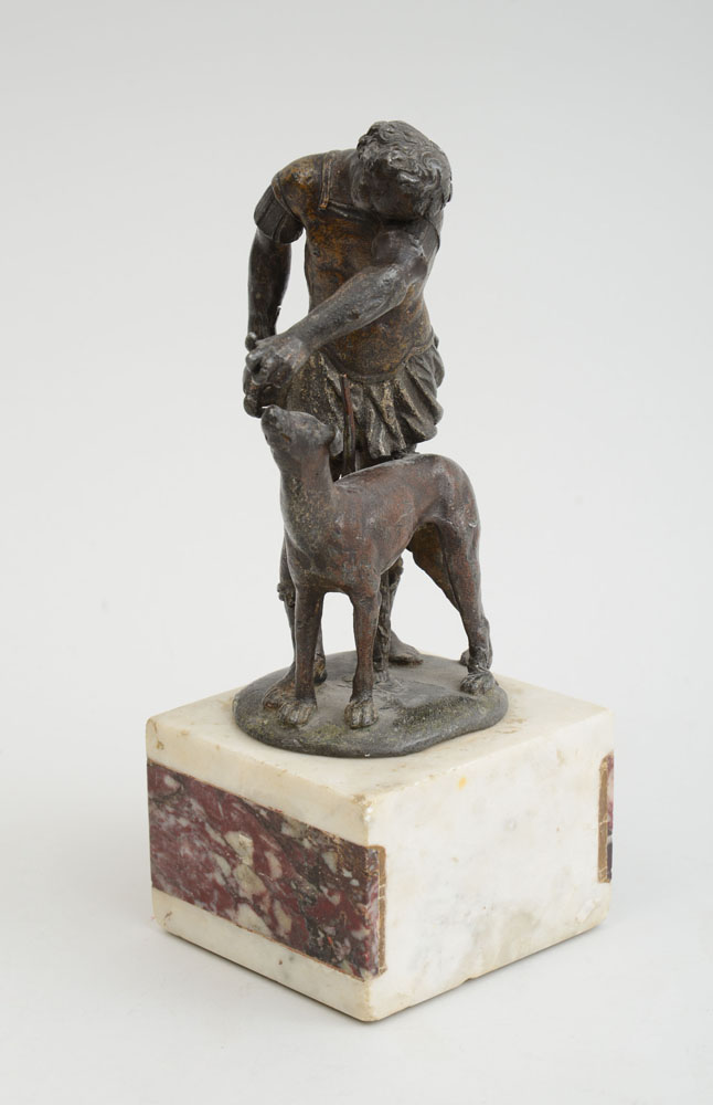 Appraisal: ITALIAN SCHOOL YOUTH WITH HOUND Bronze the sandaled youth wearing