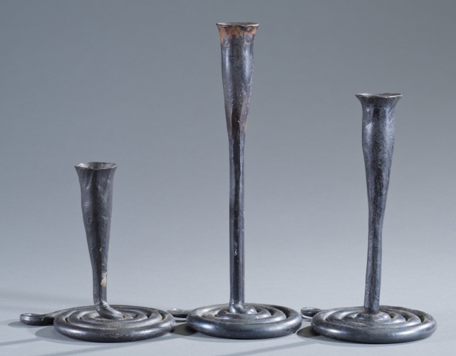 Appraisal: Three Iron Serpentine Candlesticks th century Forged by hand Unmarked