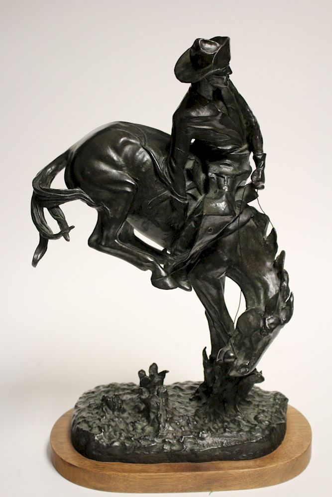 Appraisal: Reproduction Remington Bronze Sculpture Dark green black patination H x