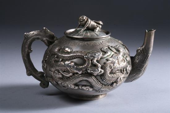 Appraisal: CHINESE SILVER TEAPOT Monkey-form handle repouss dragon decoration - Weight