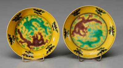 Appraisal: Pair Chinese yellow-ground dishes interiors with aubergine and green dragons