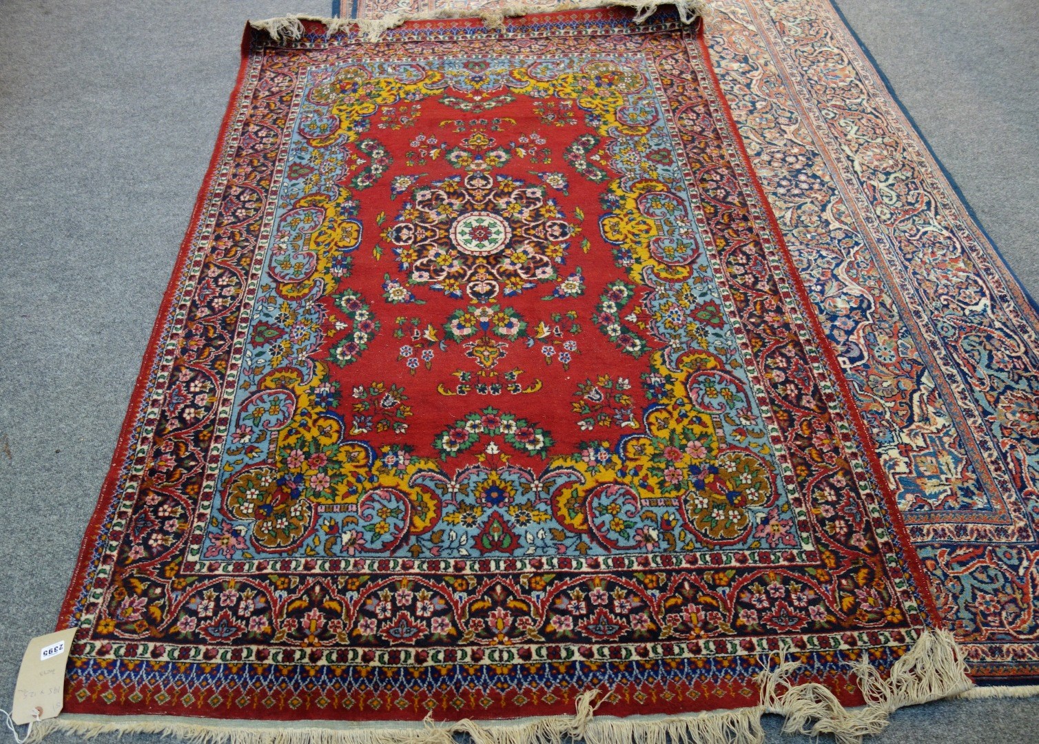 Appraisal: An Indian rug the madder field with a black medallion