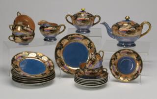 Appraisal: -piece Japanese tea set hand painted with scenic cartouches against