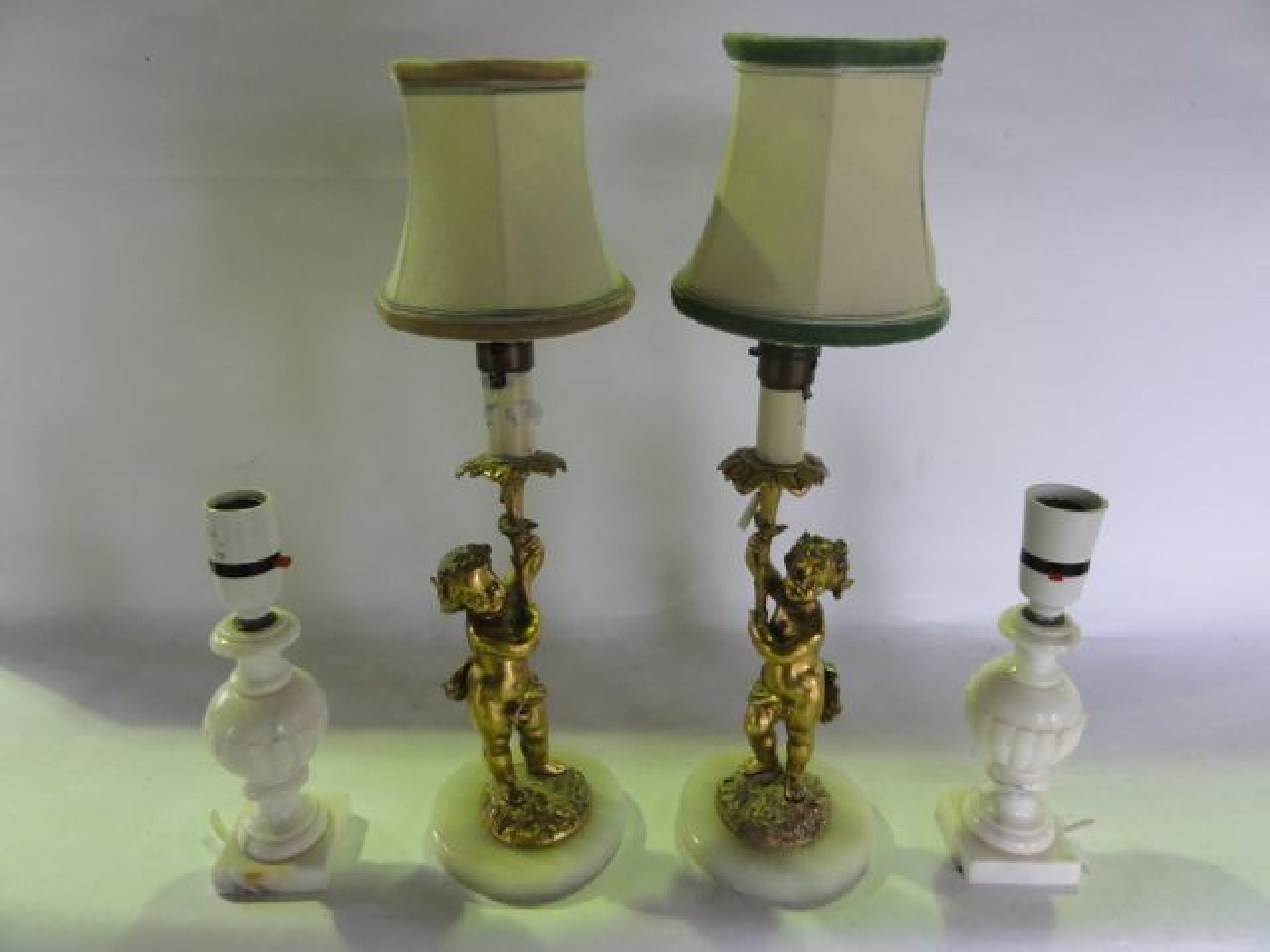 Appraisal: A pair of ormolu type desk lamps in the form