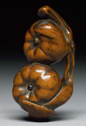 Appraisal: ANTIQUE WOOD NETSUKE Antique carved wood netsuke of two pumpkins