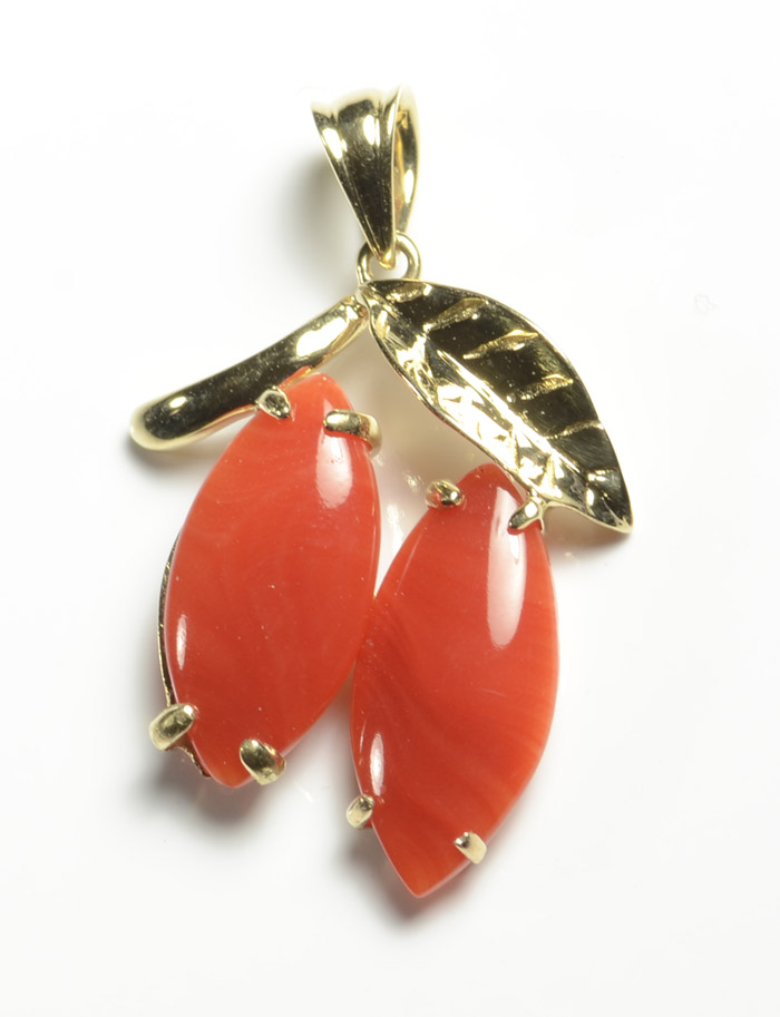 Appraisal: CORAL AND FOURTEEN KARAT GOLD PENDANT set with two marquise