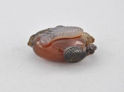 Appraisal: Small Agate Craved Fruit Carried by a Worm Carved from