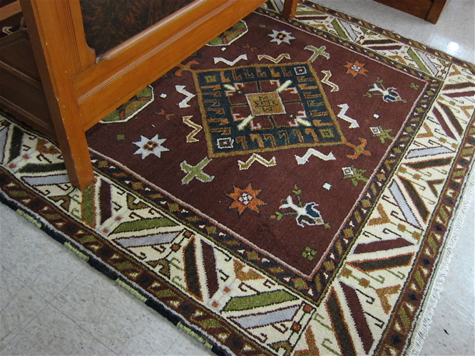 Appraisal: HAND KNOTTED ORIENTAL CARPET Persian tribal design featuring two large