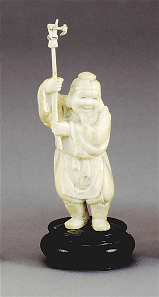 Appraisal: Japanese carved ivory okimono late th centurystanding jovial man in