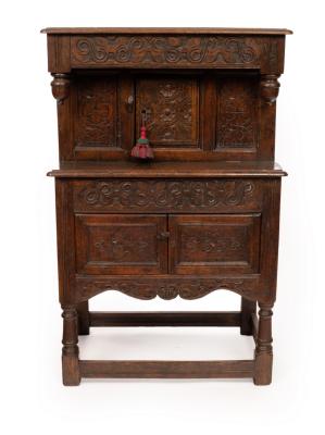 Appraisal: A small oak court type cupboard with carved frieze and