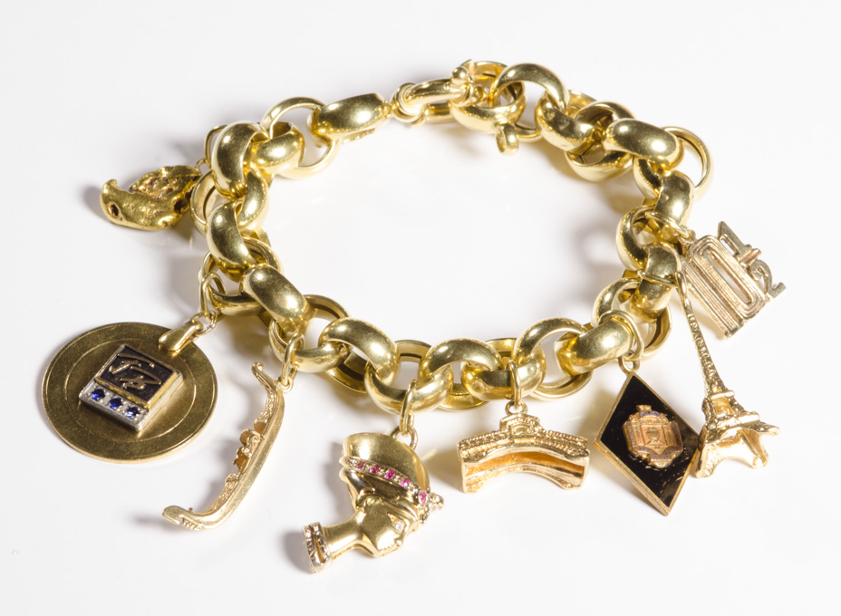 Appraisal: YELLOW GOLD CHARM BRACELET The - inch k yellow gold