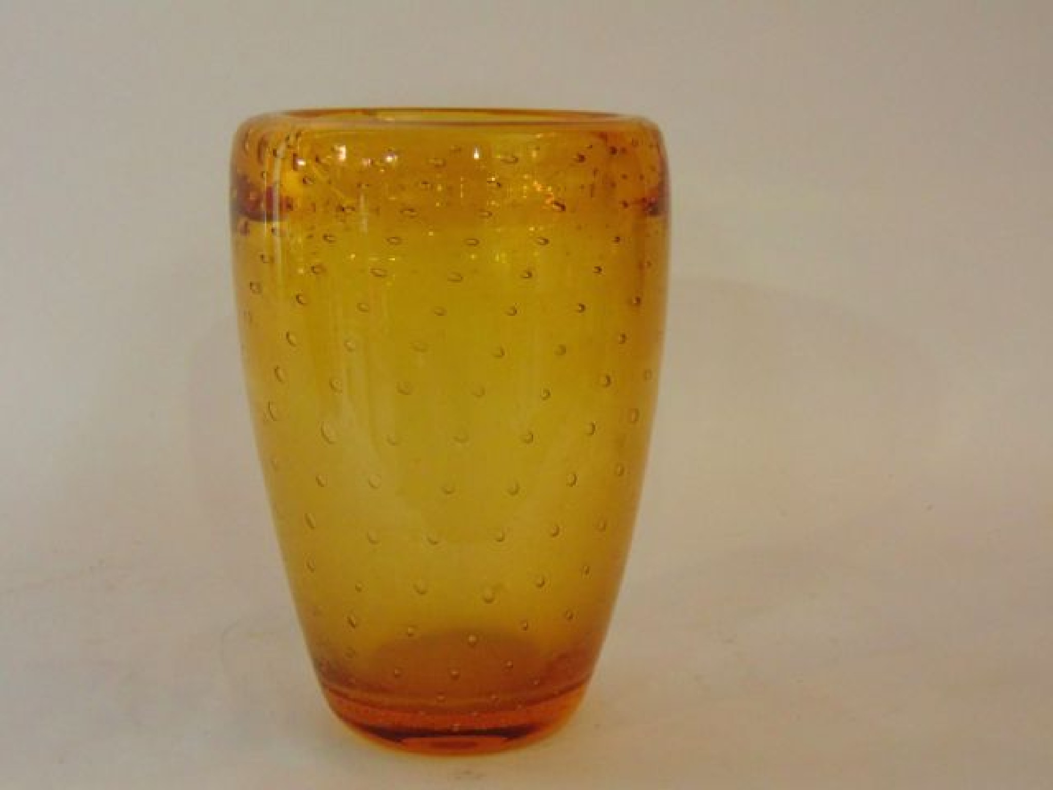 Appraisal: A heavy th century amber Studio Glass vase of tapering